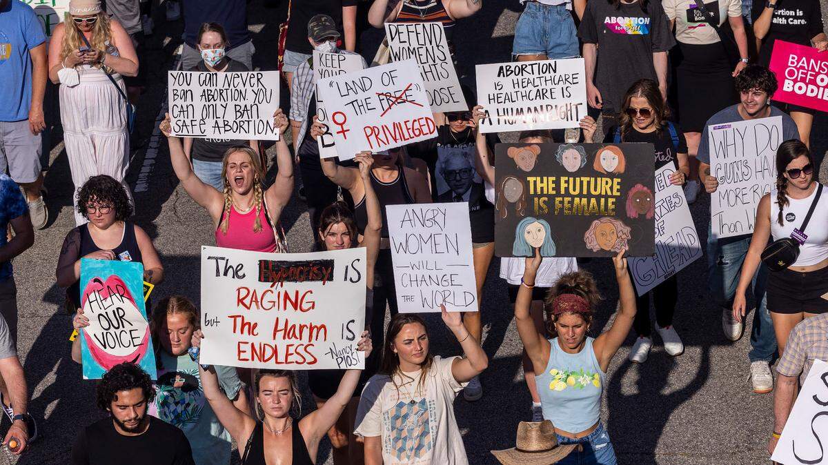 Hundreds of demonstrators rally and march in downtown Raleigh Friday, June, 24, 2022 in opposition to the U.S. Supreme Court’s decision to overturn its landmark Roe v. Wade ruling.