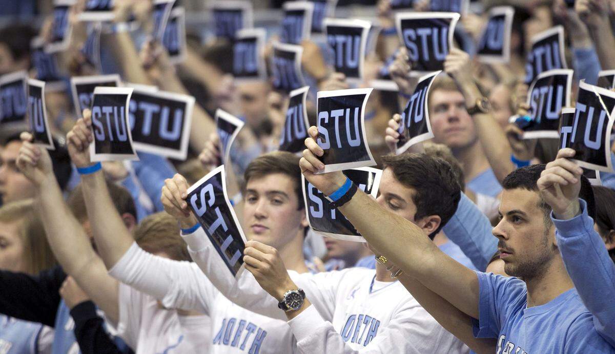 Fans in the UNC student section show their support for former UNC alumnus and ESPN sportscaster Stuart Scott who died at the age of 49, prior to the Tar Heels' game against Notre Dame on in January 2015 at the Smith Center in Chapel Hill.
