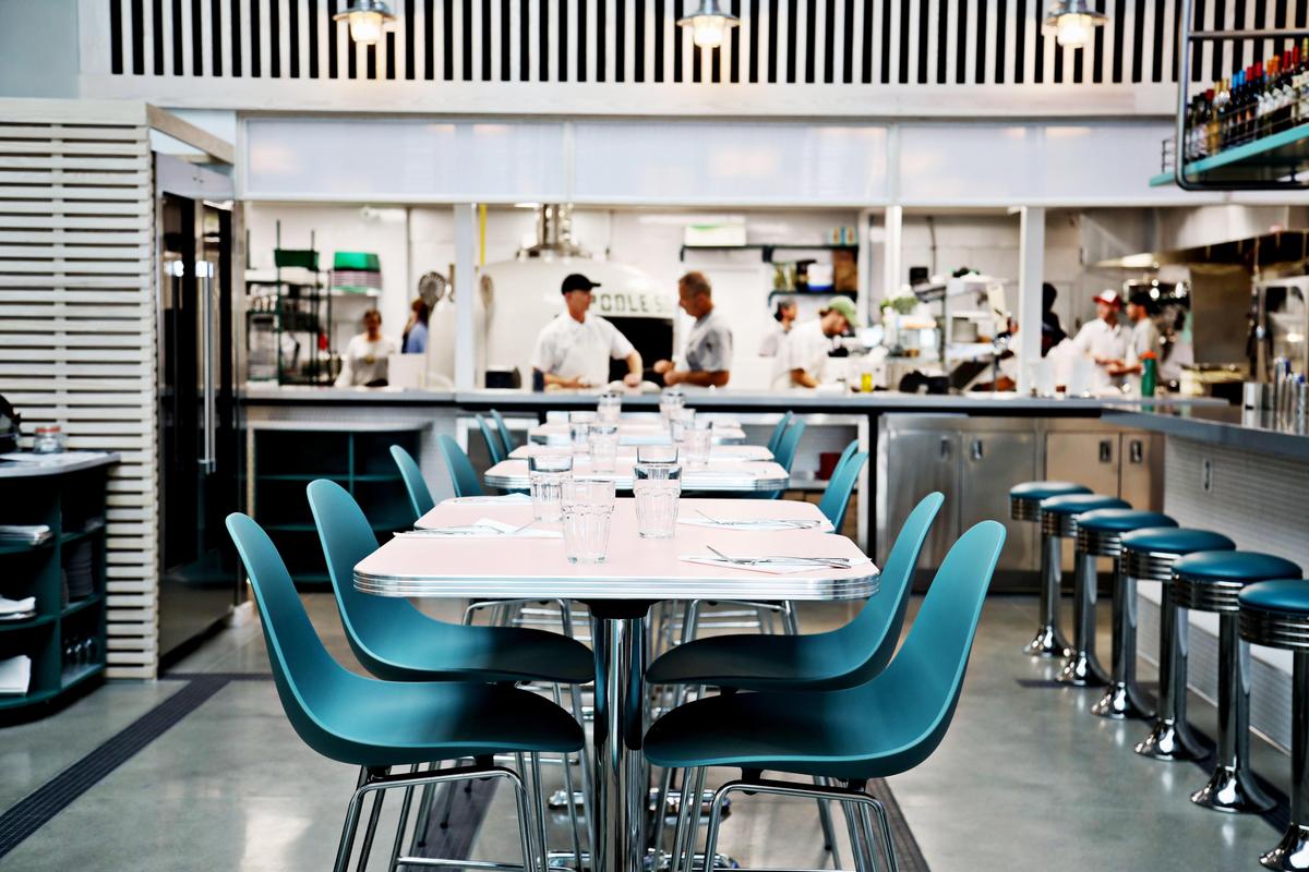 Poole’side Pies is designed after a swim club which is bright and open with the pizza oven fully visible from the dining room.