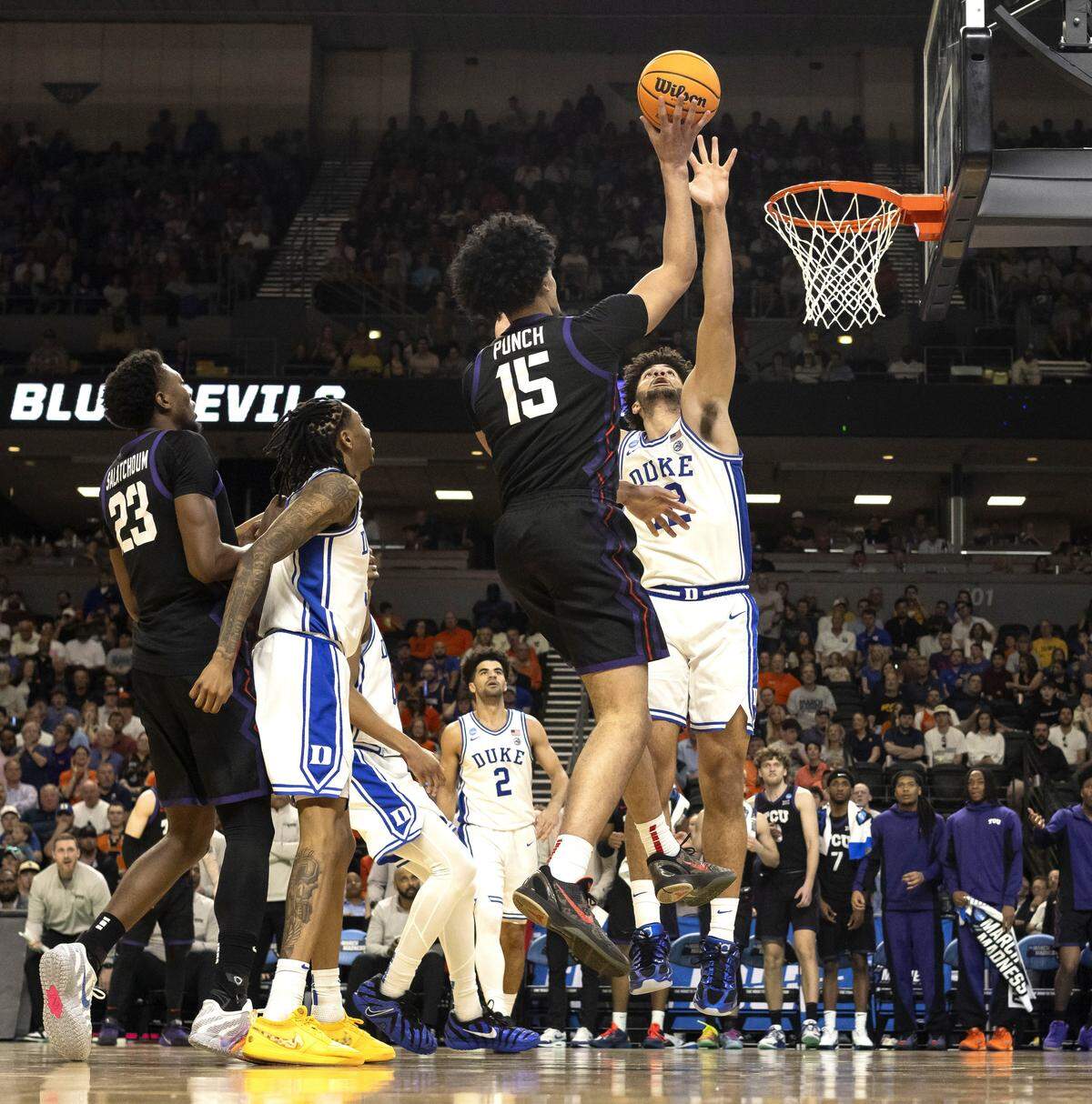 Duke forward Cameron Boozer (12) defends TCU forward David Punch (15) in the second half on Saturday, March 21, 2026, during the second round of the NCAA Tournament at Bon Secours Arena in Greenville, S.C.