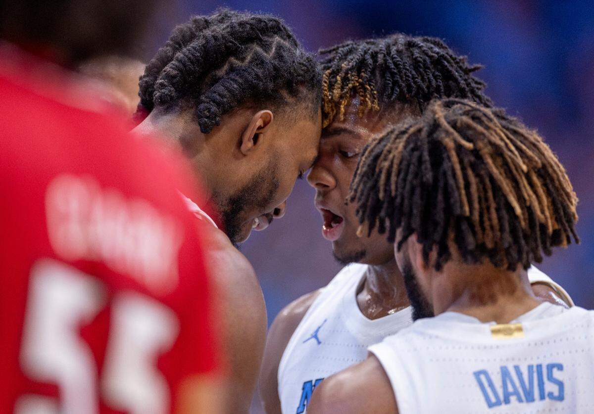 North Carolina’s Jae’Lyn Withers (24) head bumps Harrison Ingram (55) after drawing a foul against Louisville in the second half on Wednesday, January 17, 2024 at the Smith Center in. Chapel Hill, N.C.