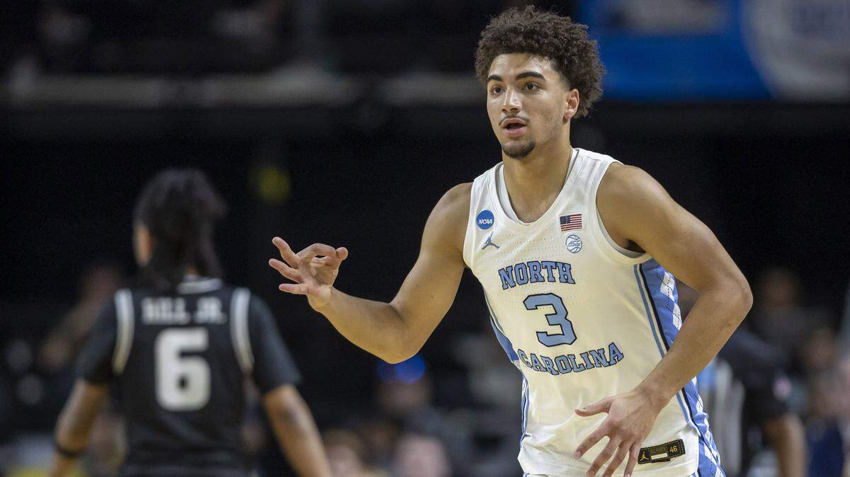North Carolina guard Derek Dixon (3) reacts after sinking a three-point basket against VCU in the first half on Thursday, March 18, 2026, during the first round of the NCAA Tournament at Bon Secours Arena in Greenville, S.C.