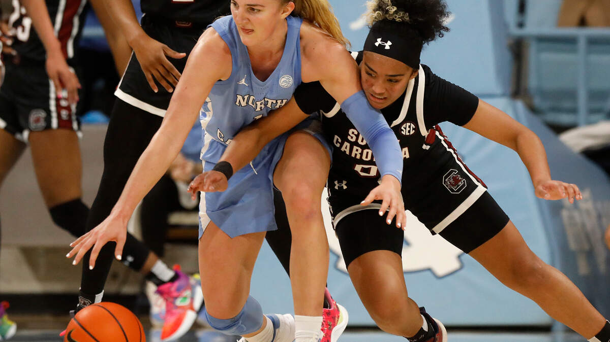 North Carolina’s Alyssa Ustby and South Carolina’s Te-Hina Paopao lunge for a loose ball during the second half of the Tar Heels’ loss on Nov. 30, 2023, at Carmichael Arena in Chapel Hill, N.C. Ustby recorded a double-double to help UNC beat Louisville on Sunday, Jan. 21, 2024.