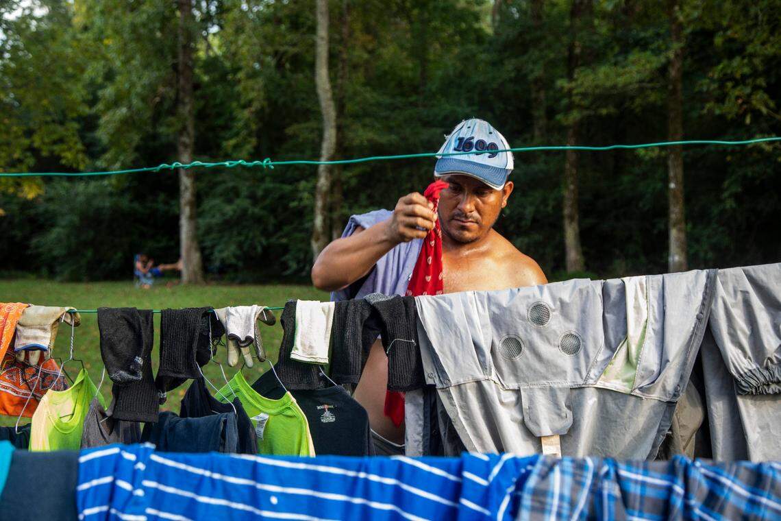 A farmworker named Fransisco dries his clothes on a clothesline at a Johnston County farmworker camp Thursday August 27, 2020.