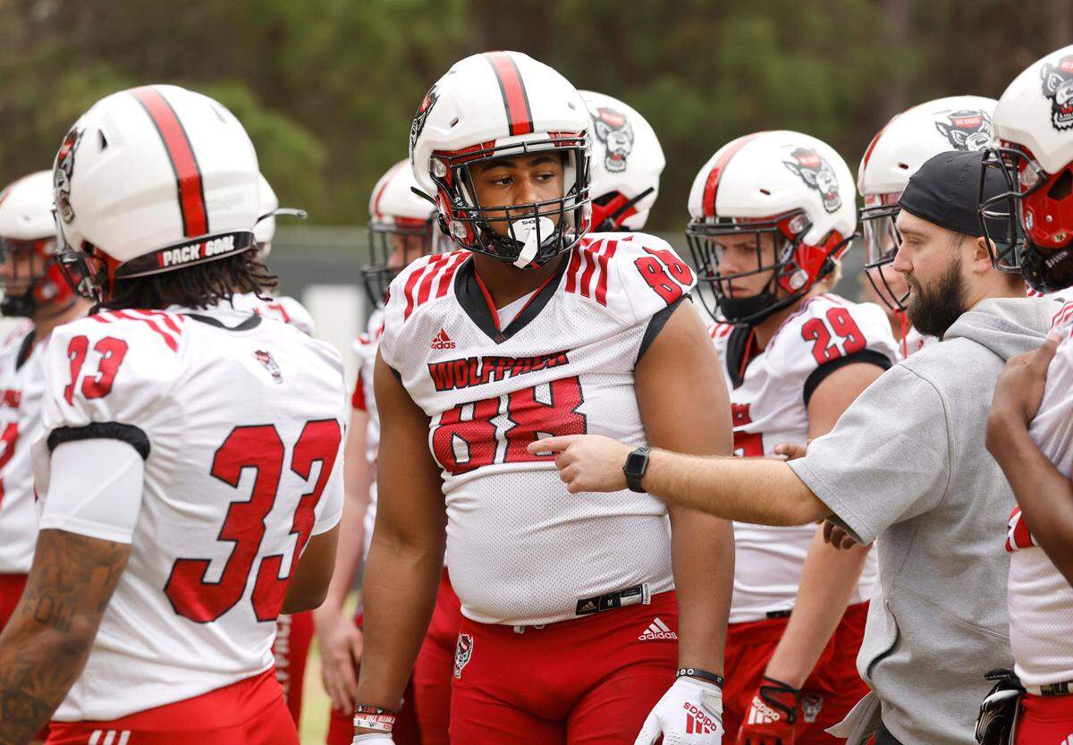 N.C. State defensive end Isaiah Shirley (88) listens to instructions during the Wolfpack’s first spring practice in Raleigh, N.C., Wednesday, March 1, 2023.