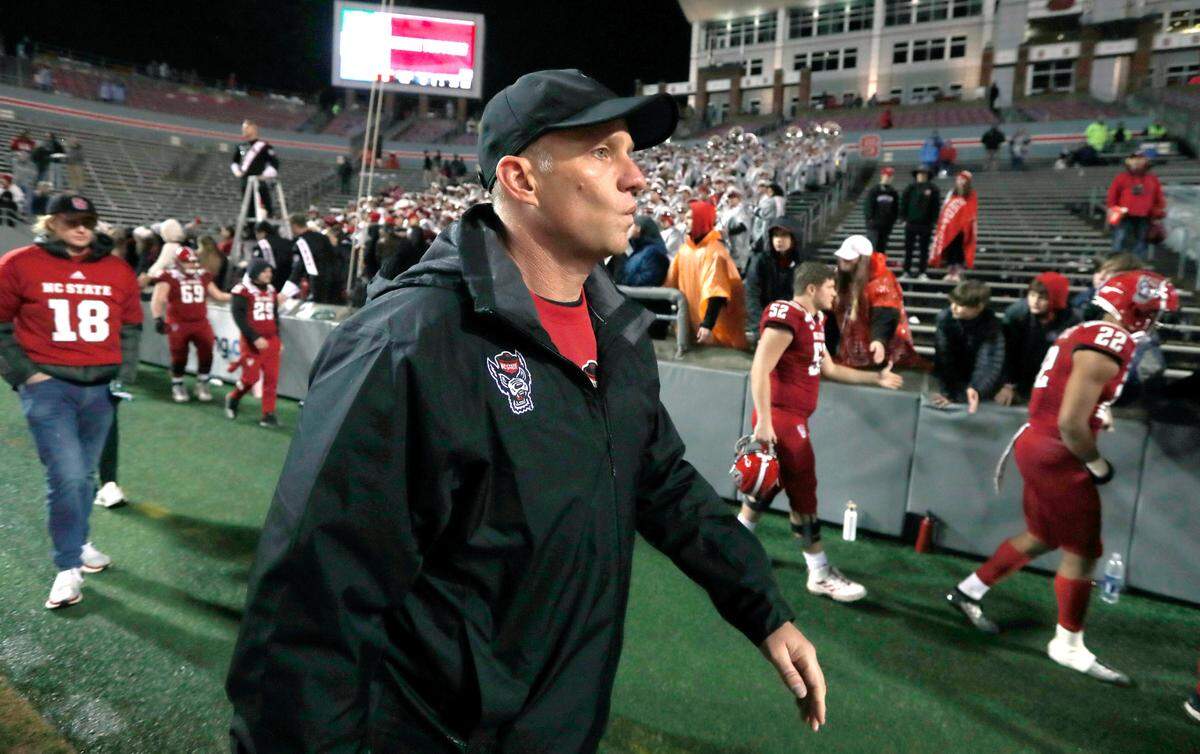 N.C. State head coach Dave Doeren walks off the field after UNC’s 41-10 victory over the Wolfpack in Raleigh in November 2019.