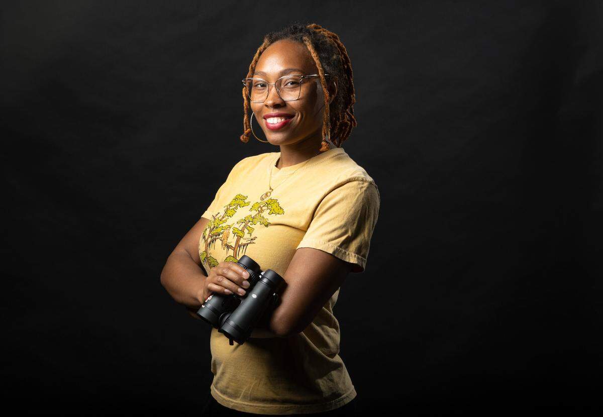 Deja Perkins, urban ecologist and co-founder of Black Birders Week, poses for a portrait in Raleigh, N.C., Thursday, Feb. 16, 2023.