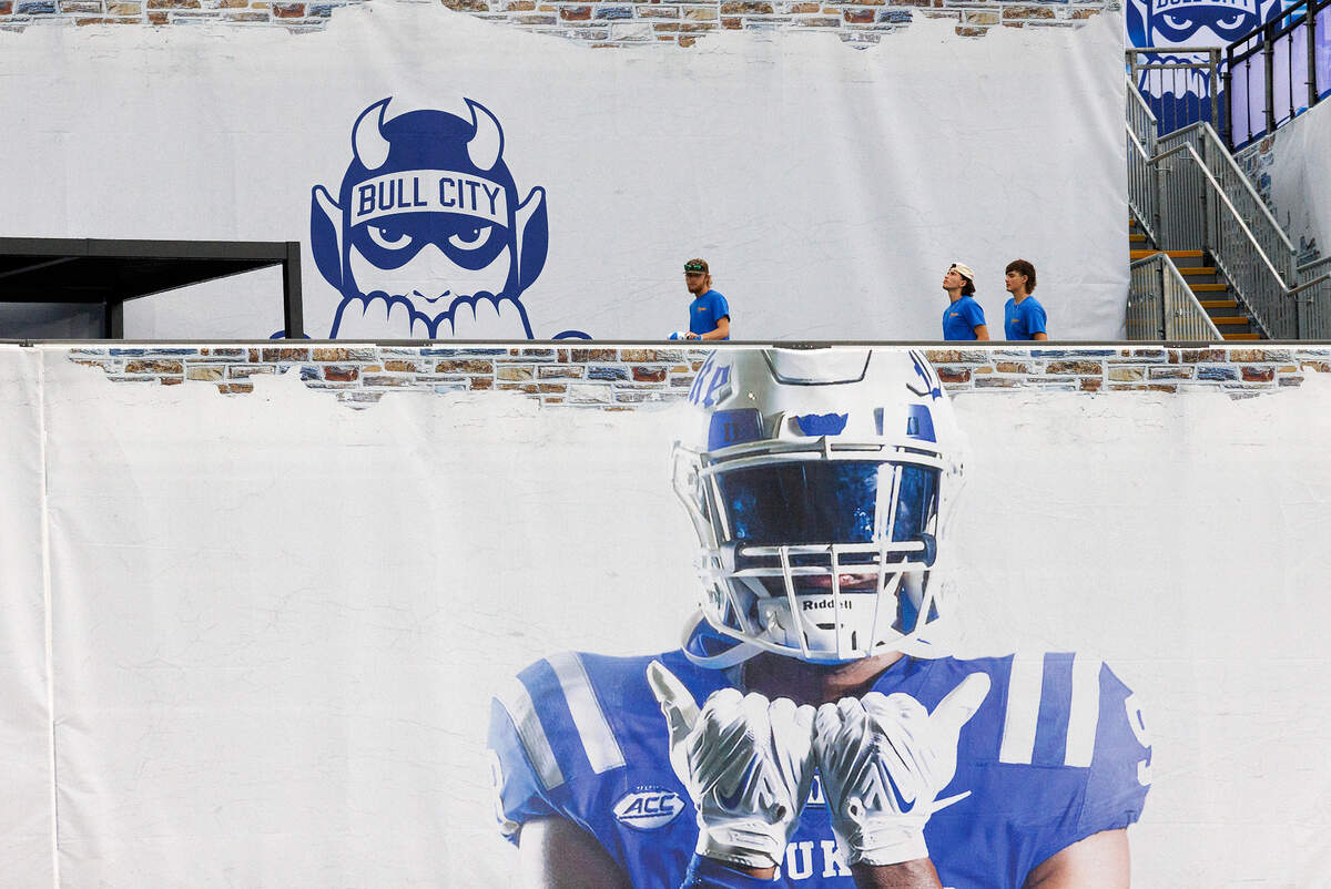 People walk along the new Devils Deck section of Wallace Wade Stadium prior to the Duke Blue Devils’ season opener against Elon on Friday, Aug. 30, 2024, in Durham, N.C.