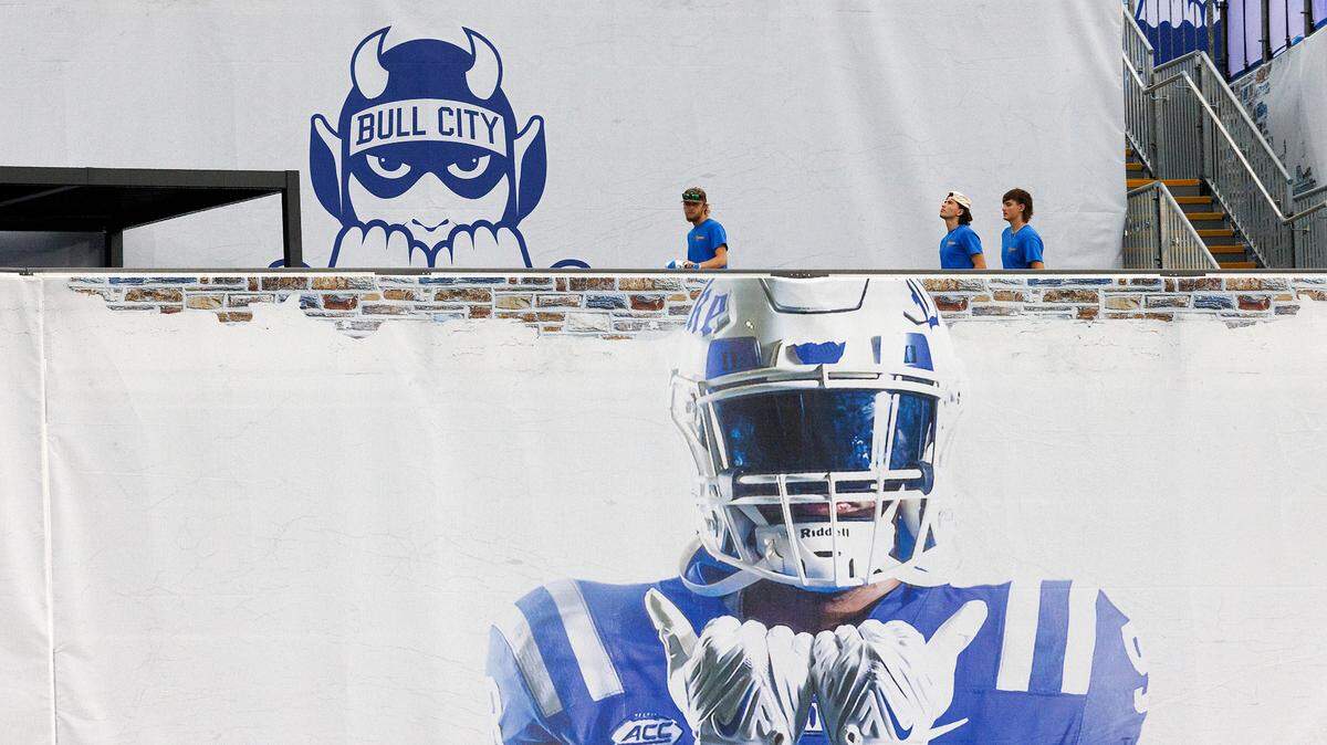 People walk along the new Devils Deck section of Wallace Wade Stadium prior to the Duke Blue Devils’ season opener against Elon on Friday, Aug. 30, 2024, in Durham, N.C.