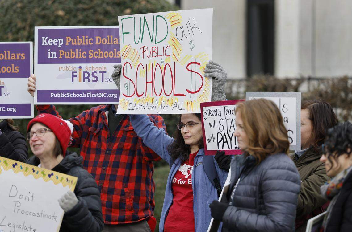 Public school advocates including Marie Dexter, president of the Wake County PTA Council, center, gather outside the N.C. Legislative Building in Raleigh to lobby for more public school funding on Wednesday. NC Teachers in Action plans to hold protests on Feb. 7, March 7 and April 7.