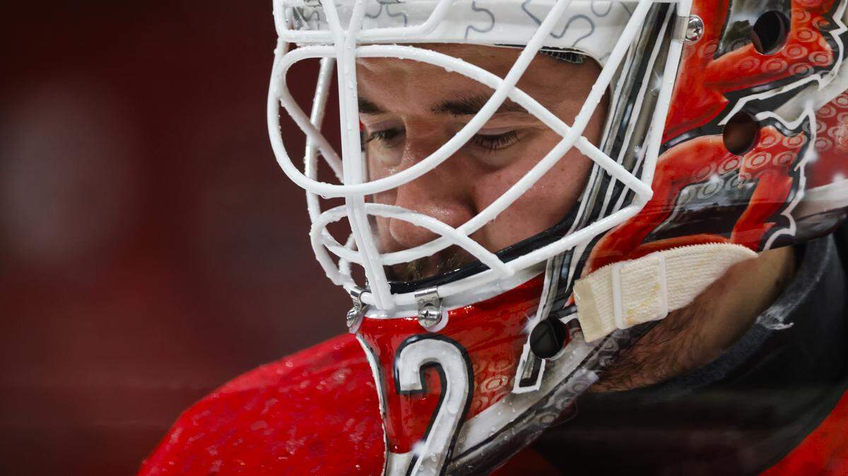 Brandon Bussi of the Carolina Hurricanes is seen in the net during the warmups against the Calgary Flames at Lenovo Center in Raleigh.