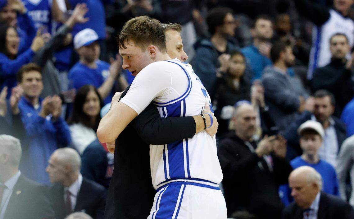 Duke’s Cooper Flagg (2) hugs head coach Jon Scheyer as time expires in Duke’s 100-93 victory over Arizona in the Sweet 16 round of the 2025 Men’s NCAA Basketball Championship at the Prudential Center in Newark, N.J., Thursday, March 27, 2025.