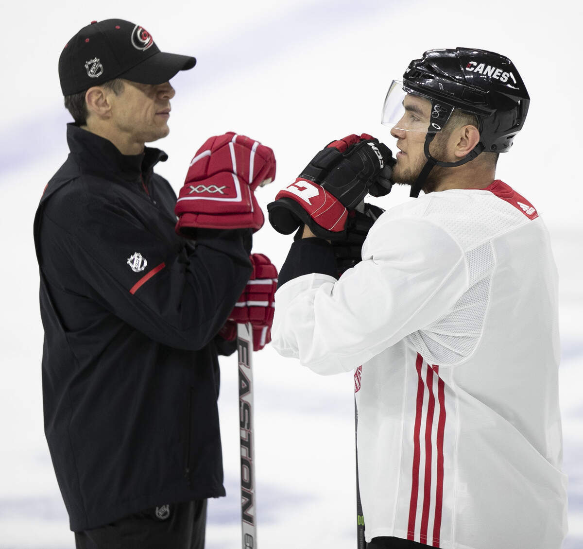 Carolina Hurricanes’ coach Rod Brind’Amour talks Micheal Ferland (79) during practice on Tuesday, April 30, 2019 at the PNC Arena in Raleigh, N.C. Ferland hopes to return to play after being out with an injury.