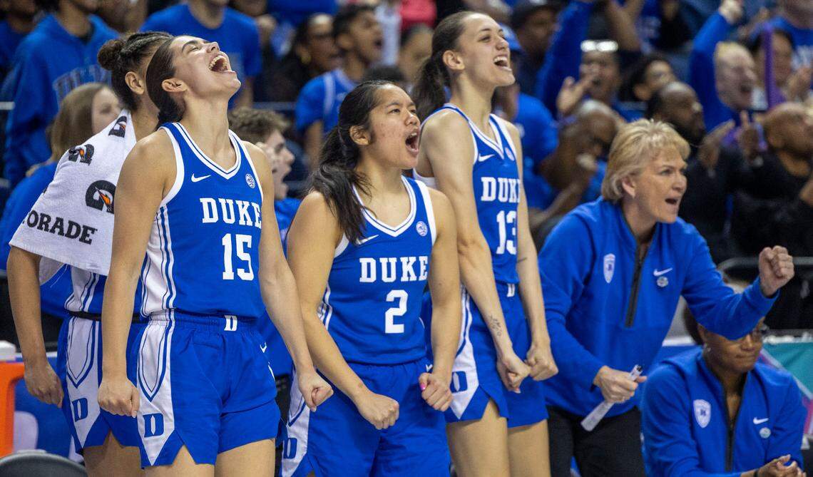 Duke players Emma Koabel (15) and Vanessa de Jesus (02) erupt in celebration after taking a lead over N.C. State in the third quarter, before rolling to a 76-62 victory, in the ACC Championship on Sunday, March 9, 2025 in Greensboro, N.C.
