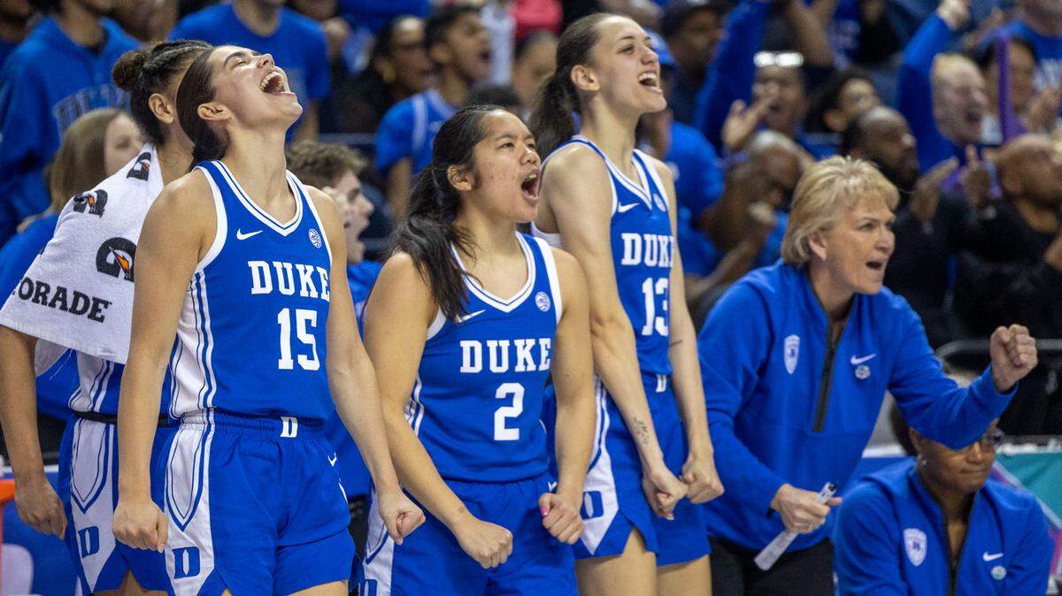 Duke players Emma Koabel (15) and Vanessa de Jesus (02) erupt in celebration after taking a lead over N.C. State in the third quarter, before rolling to a 76-62 victory, in the ACC Championship on Sunday, March 9, 2025 in Greensboro, N.C. 