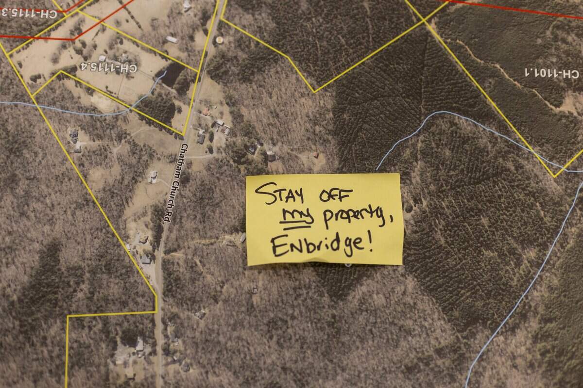 A note opposing the proposed 28-mile natural gas pipeline, was placed on a map by a local resident, during a information session by Enbridge, on Tuesday, July 28, 2026 Chatham County Agriculture & Conference Center in Pittsboro, N.C.