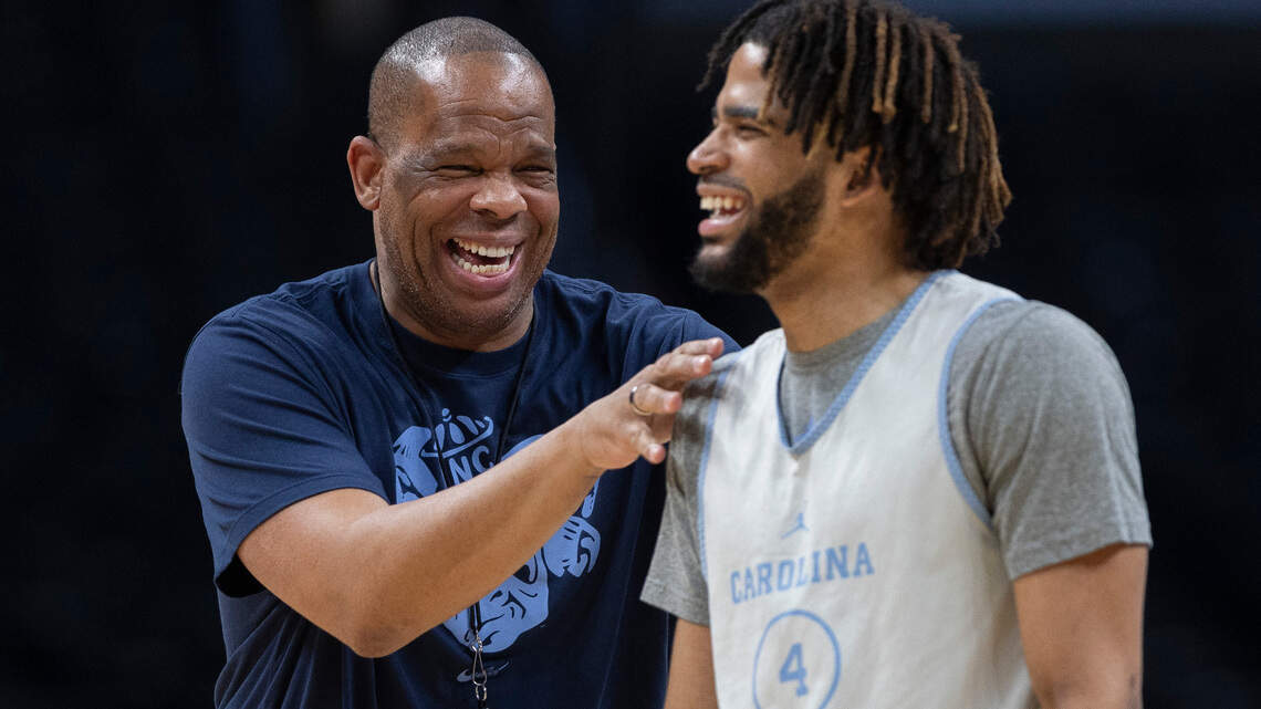 A storm surrounded UNC’s Hubert Davis a year ago. He made it out to the other side