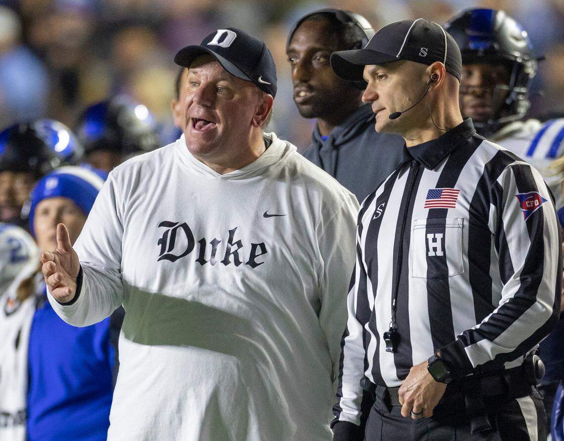 Duke coach Mike Elko argues with official Todd Riddick in the fourth quarter against North Carolina on Saturday, Nov. 11, 2023 at Kenan Stadium in Chapel Hill, N.C.