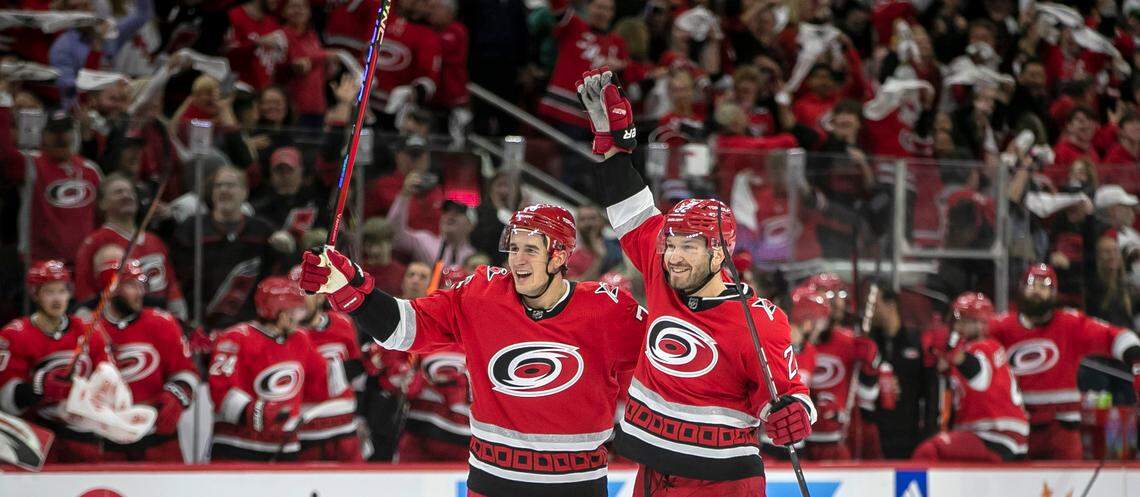 The Carolina Hurricanes Brett Pesce (22) reacts after scoring on New Jersey Devils goalie Akira Schmid (40) in the first period during Game 1 of their second round Stanley Cup playoff series on Wednesday, May 3, 2023 at PNC Arena in Raleigh, N.C.