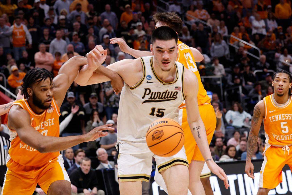 Mar 31, 2024; Detroit, MI, USA; Purdue Boilermakers center Zach Edey (15) battles Tennessee Volunteers guard Josiah-Jordan James (30) for the ball in the second half during the NCAA Tournament Midwest Regional Championship at Little Caesars Arena. Mandatory Credit: Rick Osentoski-USA TODAY Sports