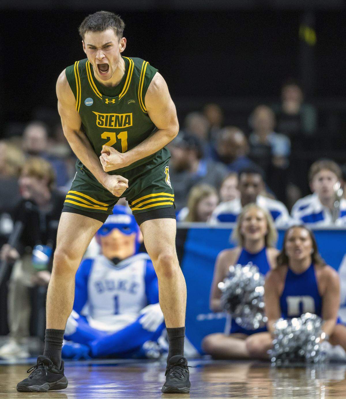 Siena forward Brendan Coyle (21) reacts after a three-point basket in the second half against Duke on Thursday, March 18, 2026, during the first round of the NCAA Tournament at Bon Secours Arena in Greenville, S.C.