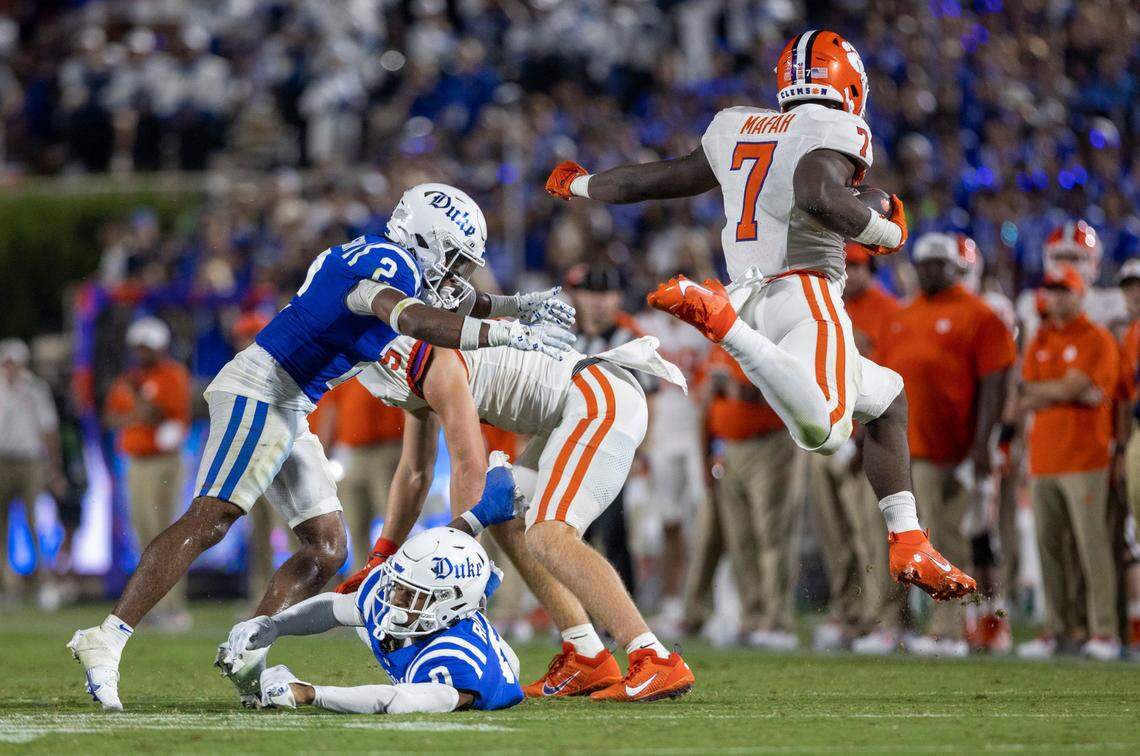 Clemson’s Phil Mafah (1) hurdles over Duke’s Chandler Rivers (0) for a five-yard gain in the second quarter on Monday, September 4, 2023 at Wallace Wade Stadium Stadium in Durham, N.C.