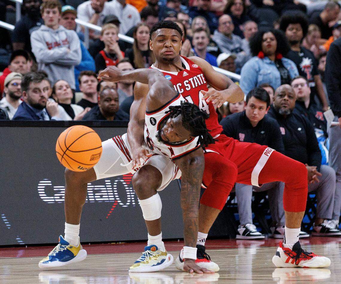 Texas Tech’s Joe Toussaint and N.C. State’s Casey Morsell collide during the second half of the Wolfpack’s 80-67 win in first round of the NCAA Tournament on Thursday, March 21, 2024, at PPG Paints Arena in Pittsburgh, Pa.