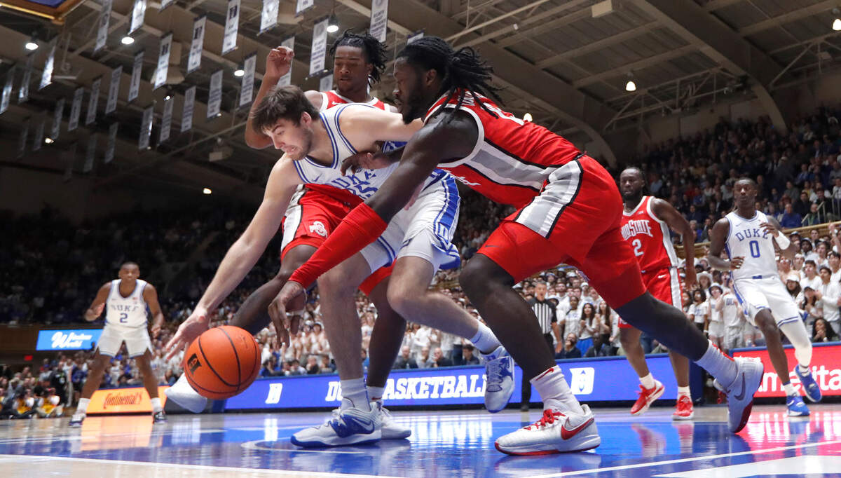Duke’s Ryan Young (15) beats Ohio State’s Isaac Likekele (13) to the ball during Duke’s 81-72 victory over Ohio State at Cameron Indoor Stadium in Durham, N.C., Wednesday, Nov. 30, 2022.