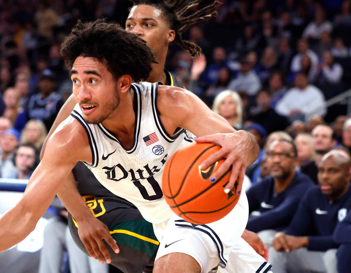 Duke’s Jared McCain (0) drives past Baylor’s Jayden Nunn (2) during the second half of Duke’s 78-70 victory over Baylor at Madison Square Garden in New York City Wednesday, Dec. 20, 2023.