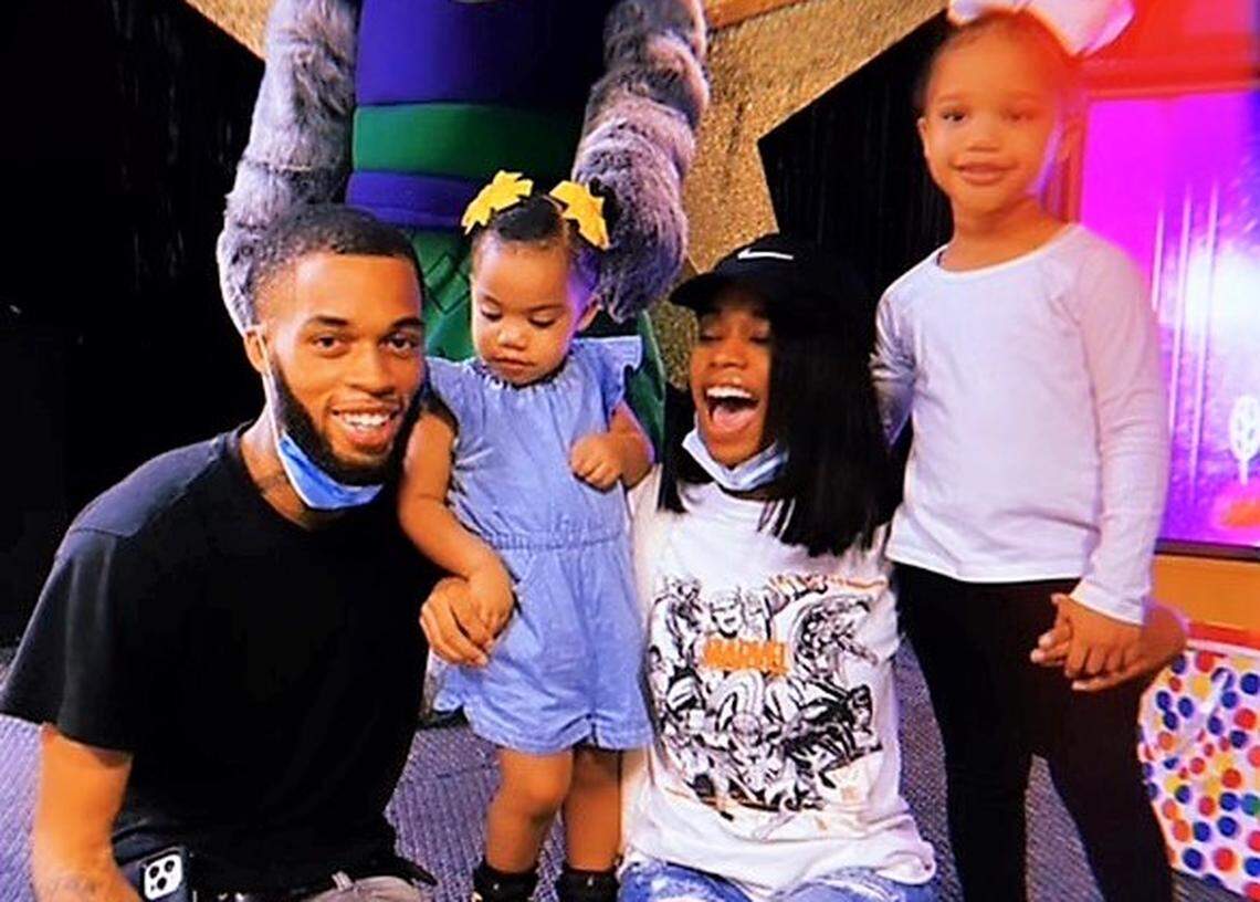 TaeVeon Young, 23, is pictured with his daughters and fiancee Bryanna Taylor. The Durham man was killed in a Jan. 31 shooting in Carrboro. Police are still seeking information and possible suspects.