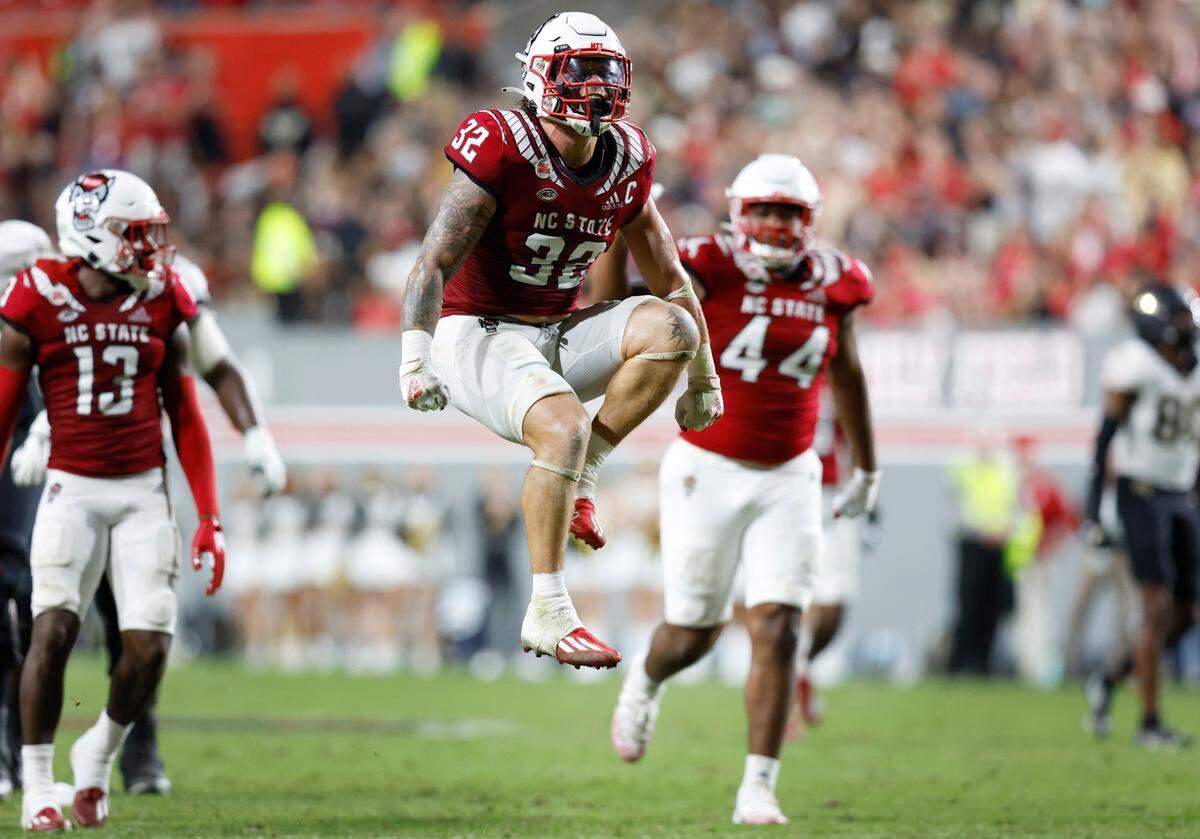 N.C. State linebacker Drake Thomas (32) celebrates after sacking Wake Forest quarterback Sam Hartman during the second half of N.C. State’s 30-21 victory over Wake Forest at Carter-Finley Stadium in Raleigh, N.C., Saturday, Nov. 5, 2022.