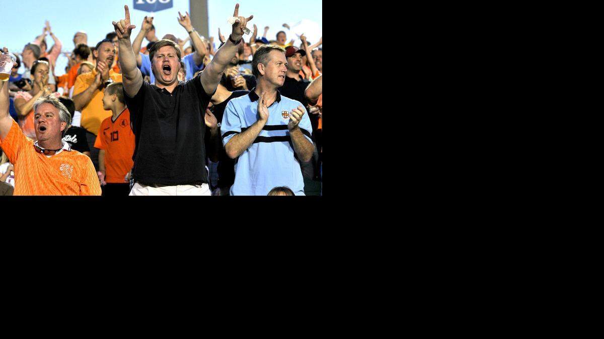Fans react to the goal scored by Carolina's Brian Shriver (21) in the second half. The Carolina Railhawks took on the Los Angeles Galaxy in the third round of the Lamar Hunt U.S. Open Cup in Cary on May 29, 2013.
