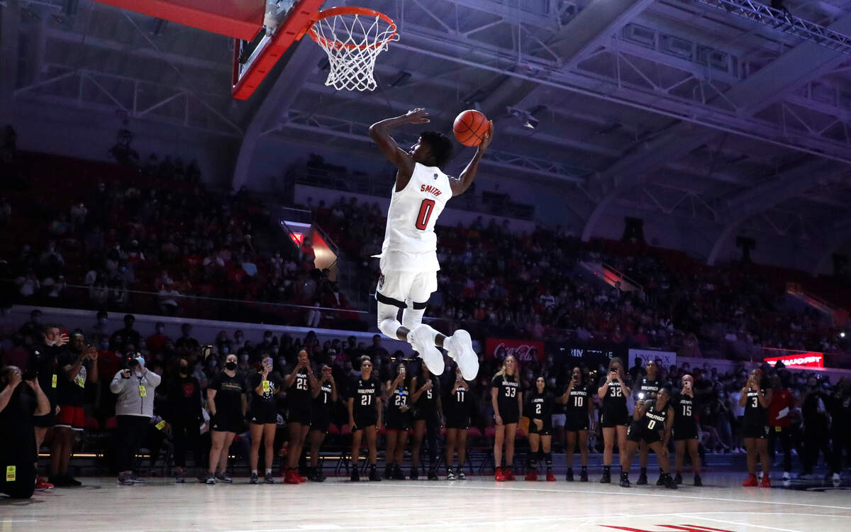 N.C. State’s Terquavion Smith (0) participates in the slam dunk contest during Primetime with the Pack at Reynolds Coliseum in Raleigh, N.C., Thursday, October 14, 2021.