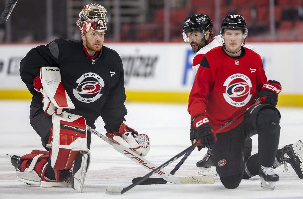Carolina Hurricanes goalie Frederik Andersen (31) chats with left wing William Carrier (28) during practice on Tuesday, May 12, 2026, at Lenovo Center in Raleigh, N.C.