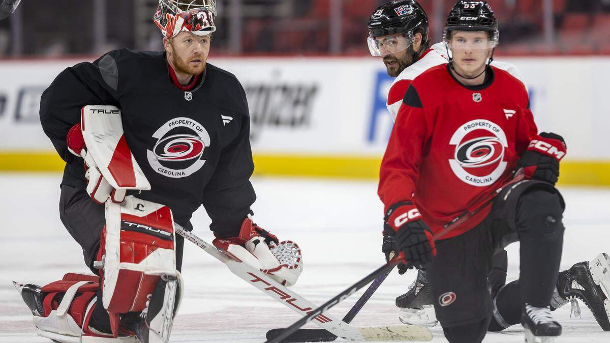 Carolina Hurricanes goalie Frederik Andersen (31) chats with left wing William Carrier (28) during practice on Tuesday, May 12, 2026, at Lenovo Center in Raleigh, North Carolina.