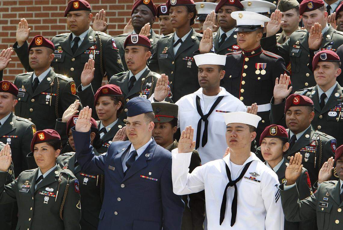 Sixty three members representing four of the U.S. armed forces take the oath of Allegiance Friday April 25, 2008 at the new Raleigh-Durham Field office for the U.S. Citizen and Immigration Services on Miami Boulevard.