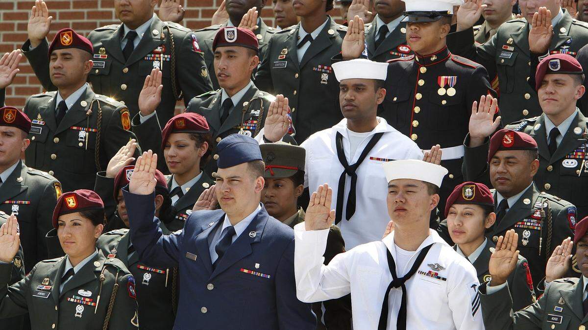 Sixty three members representing four of the U.S. armed forces take the oath of Allegiance Friday April 25, 2008 at the new Raleigh-Durham Field office for the U.S. Citizen and Immigration Services on Miami Boulevard.