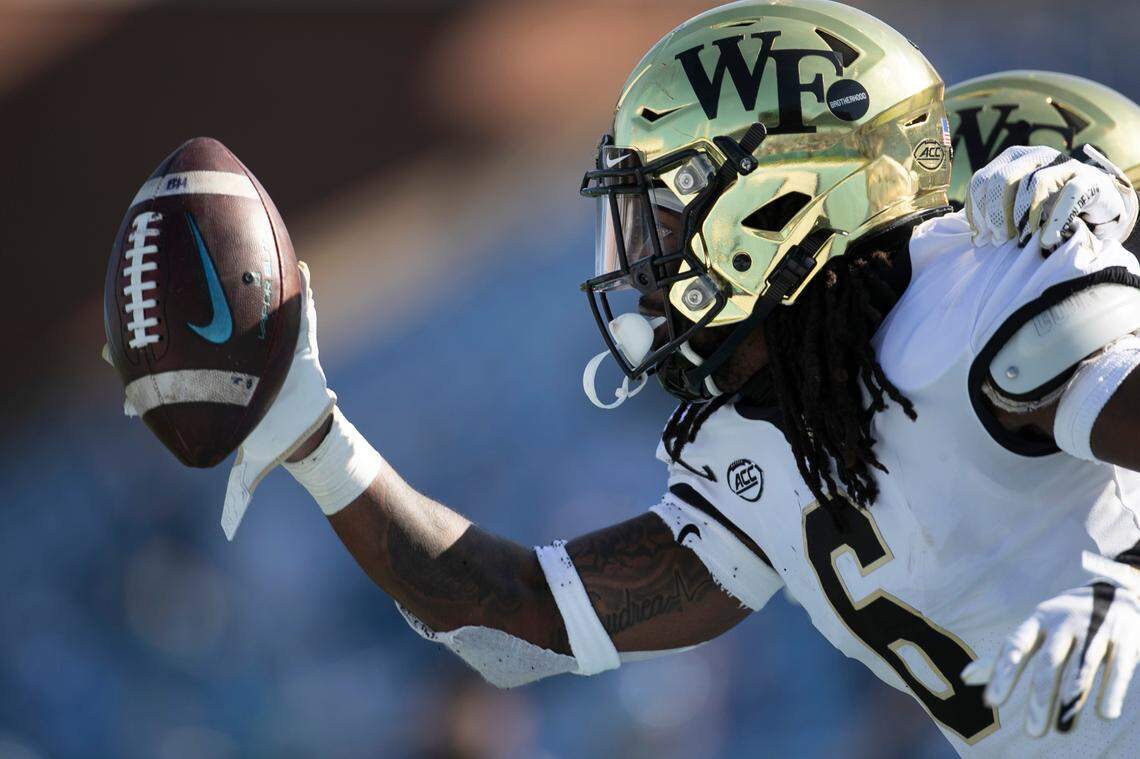Wake Forest defense back Ja’Sir Taylor (6) celebrates after intercepting a pass by North Carolina quarterback Sam Howell in the second quarter at Kenan Stadium on Saturday, November 14, 2020 in Chapel Hill, N.C