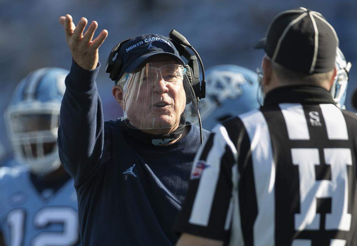 North Carolina coach Mack Brown argues with the official after an interception by Wake Forest defense back Ja’Sir Taylor (6) in the second quarter at Kenan Stadium on Saturday, November 14, 2020 in Chapel Hill, N.C.