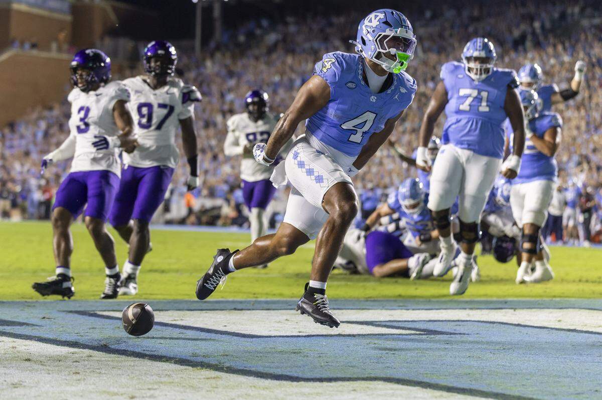 North Carolina running back Caleb Hood (4) reacts after scoring a touchdown on an eight yard run in the first quarter to take a 7-0 lead over TCU on Monday, September 1, 2025 at Kenan Stadium in Chapel Hill, N.C. 