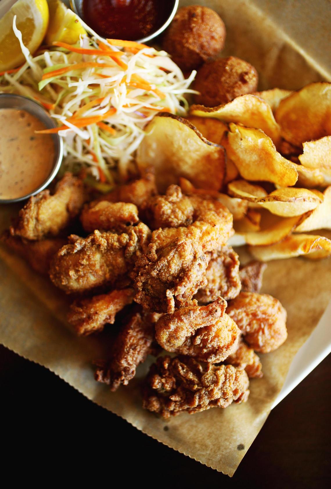 If it’s Southern comfort, Carolina style, that you’re craving, look no further than the Cedar Island Fry at Postal Fish Company in Pittsboro. Catfish, oysters and jumbo shrimp, all perfectly cooked in a light, crisp breading, are piled onto a parchment paper-lined plate with hushpuppies, house-made potato chips (a welcome twist on the usual fries) and crunchy icebox slaw.