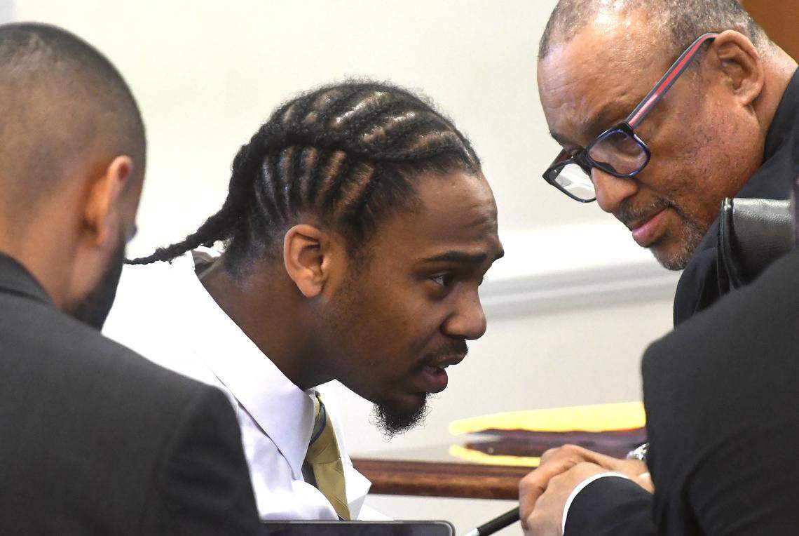 Ramone Alston (center)  speaks with members of his legal team including James D. (Butch) Williams (right) in an Orange County Superior courtroom on May 21, 2018, where is on trial on a charge of killing 1-year-old Maleah Williams on Christmas Day 2015 in Chapel Hill.