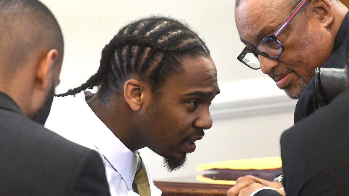 Ramone Alston (center)  speaks with members of his legal team including James D. (Butch) Williams (right) in an Orange County Superior courtroom on May 21, 2018, where is on trial on a charge of killing 1-year-old Maleah Williams on Christmas Day 2015 in Chapel Hill.

