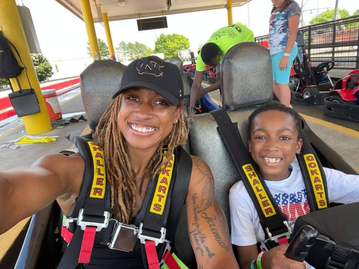 Former North Carolina Courage and US Women’s National Team player Jessica McDonald, left, with her son, Jeremiah Stuart, getting ready to drive go-karts.