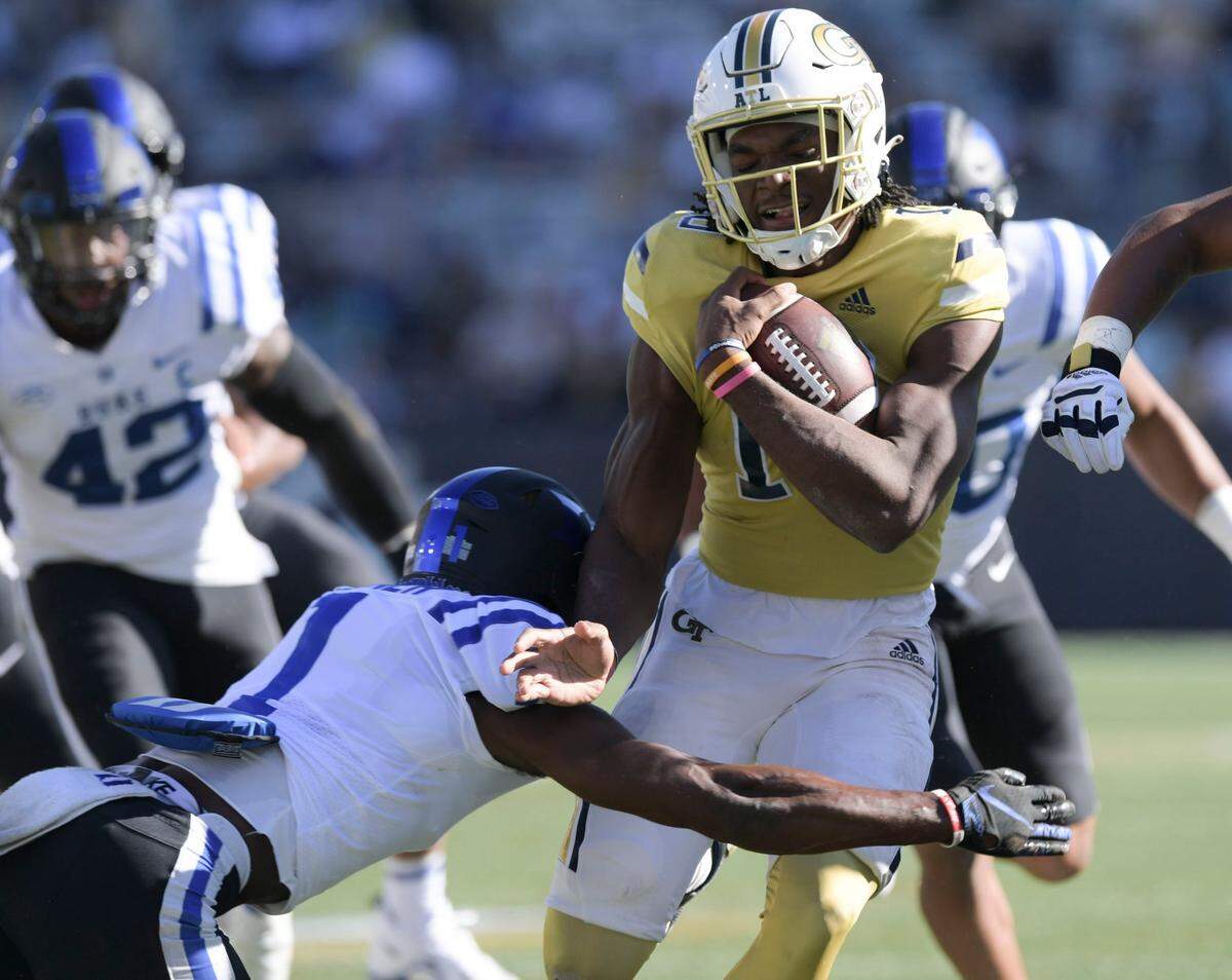 Georgia Tech wide receiver Leo Blackburn (1) gains yardage against the Duke defense during the first half of an NCAA college football game, Saturday, Oct. 8, 2022, at Bobby Dodd Stadium, in Atlanta. (Daniel Varnado/Atlanta Journal-Constitution via AP)