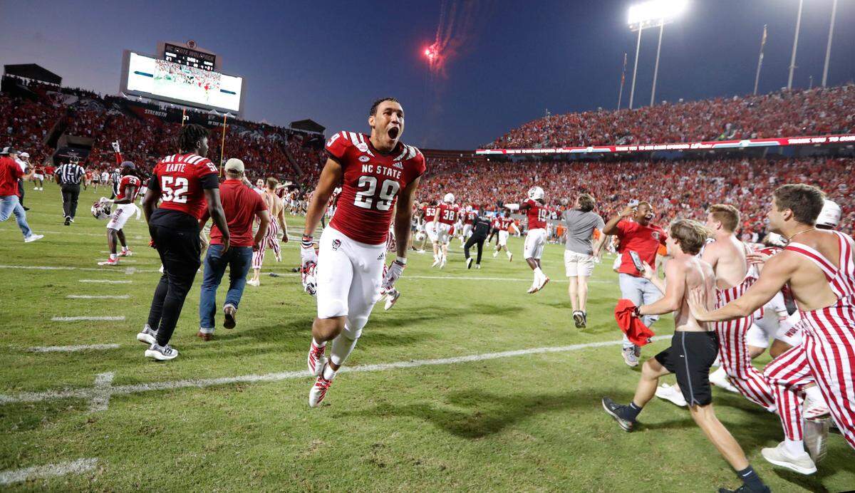 N.C. State wide receiver Christopher Toudle celebrates after the Wolfpack’s 27-21 overtime win over Clemson at Carter-Finley Stadium on Sept. 25.