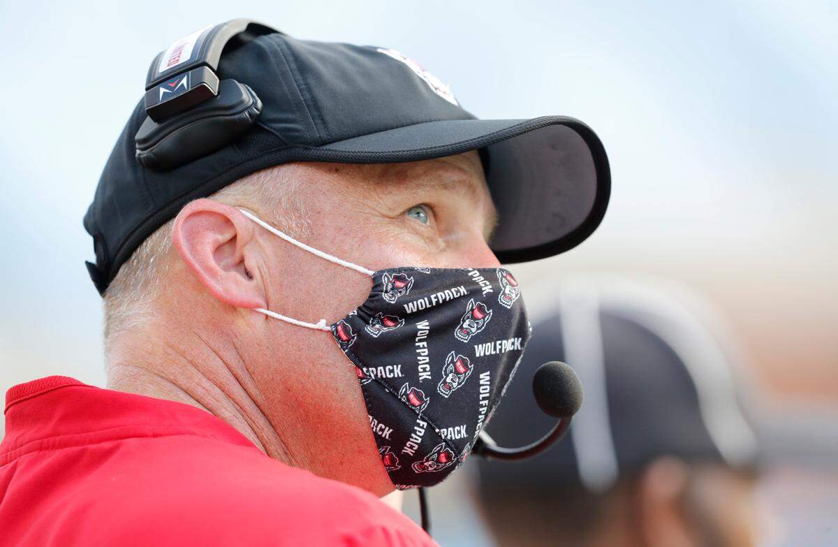 N.C. State head coach Dave Doeren looks up at the scoreboard during the second half of UNC’s 48-21 victory over N.C. State at Kenan Stadium in Chapel Hill, N.C., Saturday, Oct. 24, 2020.