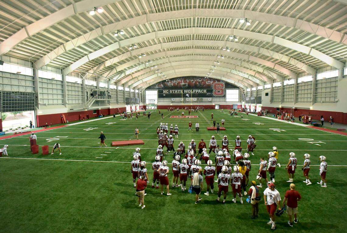The N.C. State football team go through drills during the first day of practice at the Wolfpack’s indoor practice facility in Raleigh, N.C. Friday, August 3, 2018.