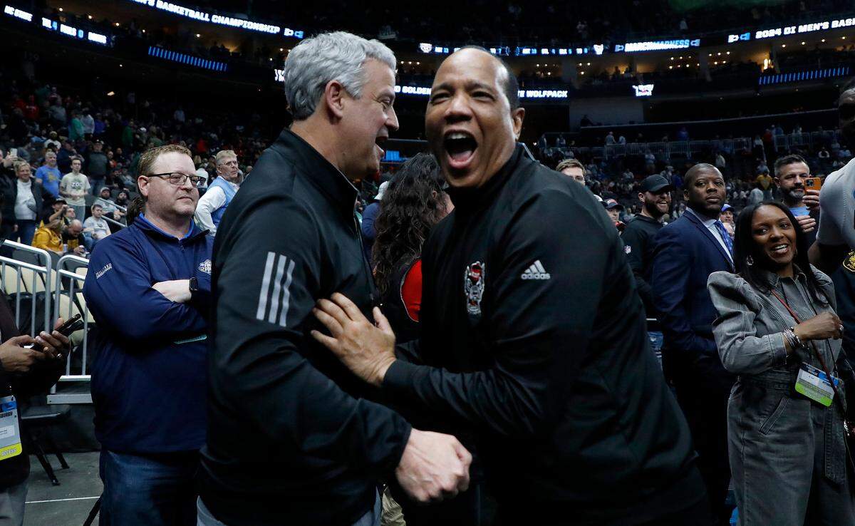 N.C. State head coach Kevin Keatts celebrates with athletic director Boo Corrigan following the Wolfpack’s 79-73 overtime win against Oakland in the second round of the NCAA Tournament on Saturday, March 23, 2024, at PPG Paints Arena in Pittsburgh, Pa.