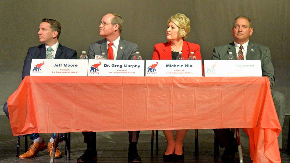 Republican 3rd Congressional District candidates (l-r) Jeff Moore, Dr. Greg Murphy, Michele Nix and Mike Payment wait their turn to answer questions during a forum for GOP candidates seeking their party’s nomination in the April 30 primary election, at Currituck County Middle School in Barco, Tuesday evening. Sixteen of the 17 GOP candidates seeking to succeed the late Walter B. Jones in Congress attended the forum.
